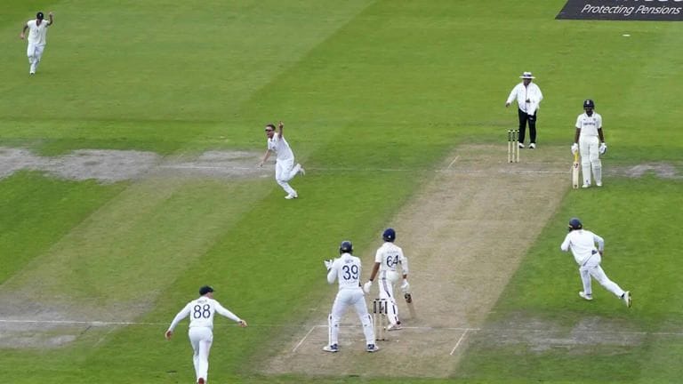 India in Trouble: Batting Collapse Rocks Day Two England player celebrating on ground after taking Indian players wicket.