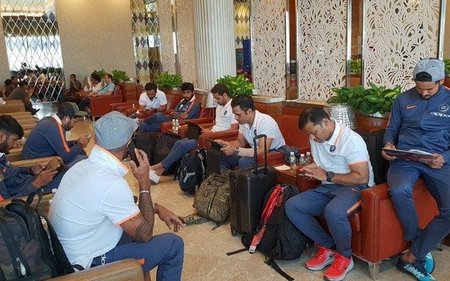 Indian cricket players at an airport with their luggage