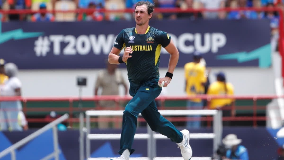 Mitchell Starc bowls in a T20 match, eyes fixed on the target.