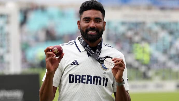 Mohammed Siraj celebrates a medal at the Oval, holding the ball aloft after a five-wicket haul.