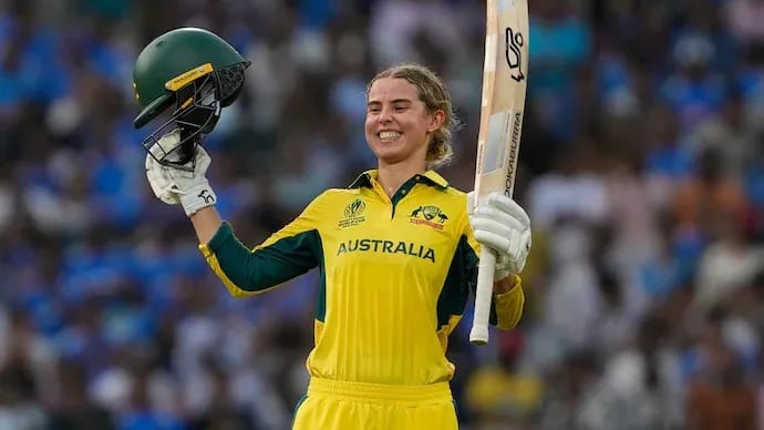 Phoebe Litchfield celebrating her record-breaking 77-ball century against India in the Women's World Cup 2025 semifinal at DY Patil Stadium, as Australia post 338—the highest semifinal total ever.