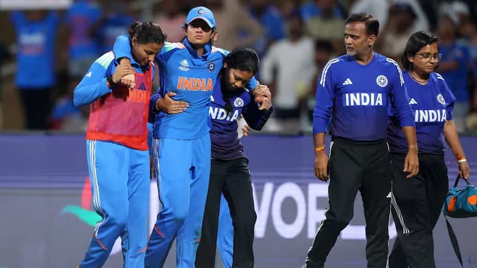 Pratika Rawal being assisted off the field after sustaining an ankle injury during India's Women's World Cup match against Bangladesh, leading to her being ruled out of the tournament.