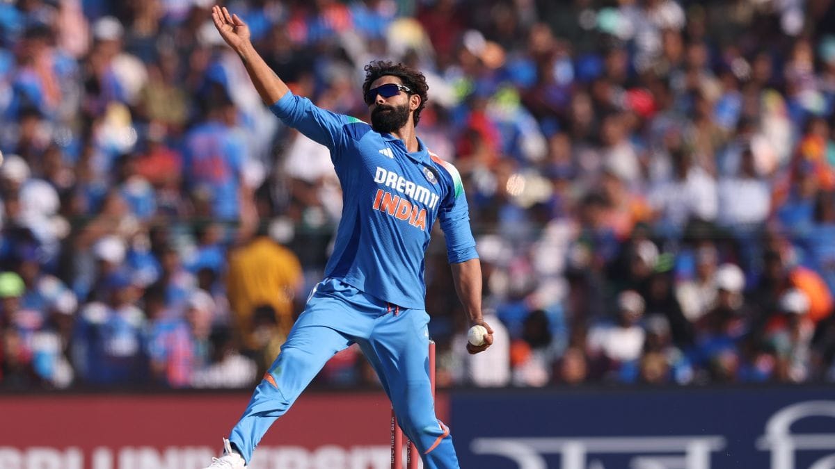 Ravindra Jadeja during an earlier match bowling as he is now excluded from India's Australia ODI squad, sparking criticism from Sadagoppan Ramesh who questioned if the all-rounder is treated as "extra baggage" by selectors.