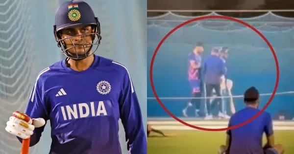 Shubman Gill pauses in the nets holding his hand as the physio attends, before resuming batting under lights in Dubai.