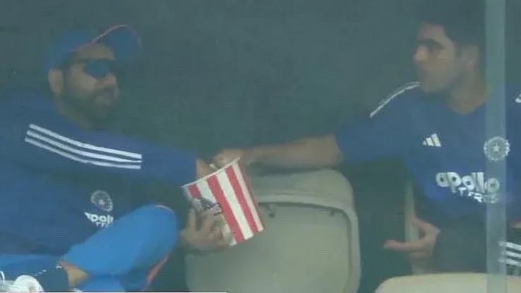 Popcorn and Captaincy: Shubman Gill and Rohit Sharma Share Laughs During Rain Break in Perth ODI Shubman Gill and Rohit Sharma laughing and sharing popcorn during rain break in the dressing room at Optus Stadium, Perth during the 1st ODI against Australia in 2025.