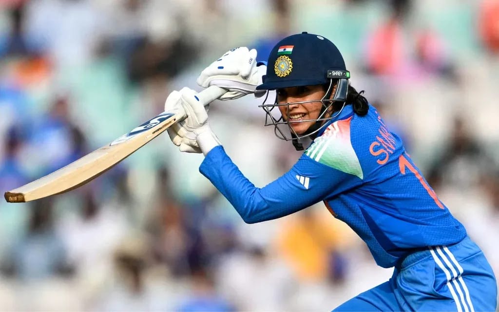 Smriti Mandhana celebrating after scoring a century, equalizing Meg Lanning’s record of most international centuries in women’s cricket during ICC Women’s World Cup 2025.