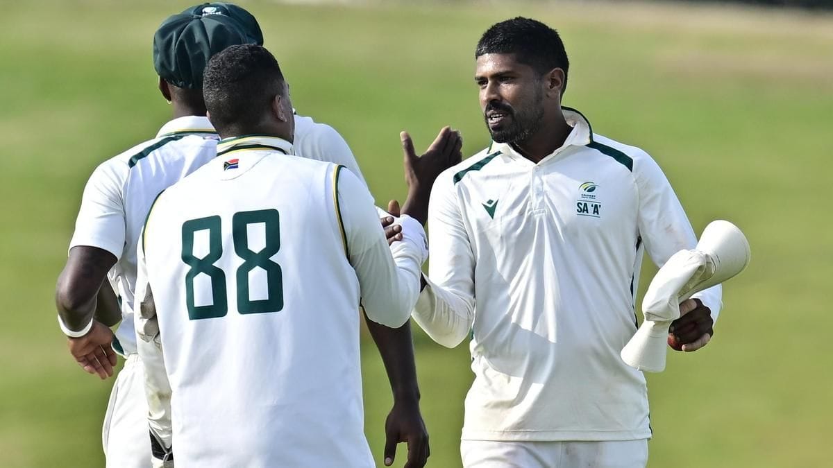 South Africa A batsmen celebrating record 417-run chase against India A bowling attack featuring Mohammed Siraj and Kuldeep Yadav in Bengaluru unofficial Test
