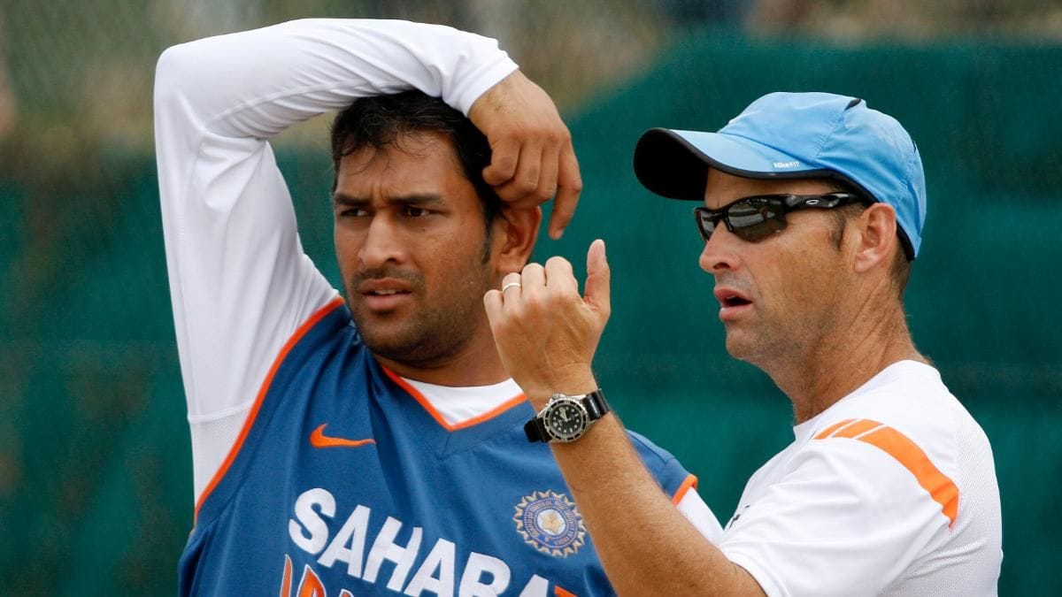 Virat Kohli Shares a Secret: How Dhoni and Kirsten Gave Him His Big Break MS Dhoni and Team India's Coach Gary Kirsten taking during a practice session in ICC World Cup 2011